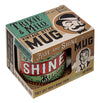 ceramic tea or coffee mug. cafe cup reads "Rise and Shine Bitches" in white, red, green, orange and black retro vintage style presented in kitschy gift box